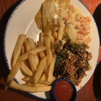 Red Lobster - Lobster-Topped Stuffed Flounder, Crispy Brussels Sprouts, Sea-Salted Fries - Seafood Near Me - Carle Place, New York Red Lobster - Lobster-Topped Stuffed Flounder, Crispy Brussels Sprouts, Sea-Salted Fries - Seafood Near Me - Carle Place, New York