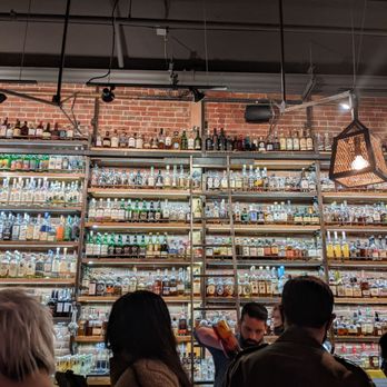 Paper Plane - Bottle wall - Cocktail Bars Near Me - San Jose, California Paper Plane - Bottle wall - Cocktail Bars Near Me - San Jose, California