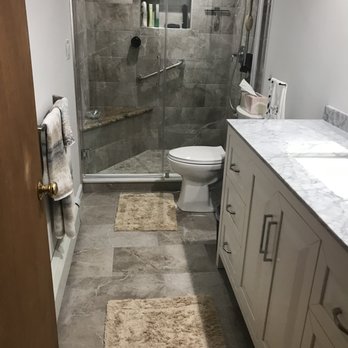 Dream House Services - a bathroom with a walk in shower - General Contractors Near Me - Randolph, Massachusetts