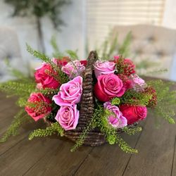 Cadeau De Fleurs - Basket Blooms! A beautiful basket filled with a blend of pink colored roses! The perfect spring arrangement for any occasion!