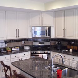 Miracle Method Surface Refinishing - Ashburn refinished cabinets from mdf white to almond really dressed up the kitchen after the new granite tops were added.