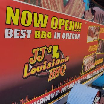 JJ's Louisiana BBQ - a woman standing in front of a sign - Barbeque Near Me - Portland, Oregon JJ's Louisiana BBQ - a woman standing in front of a sign - Barbeque Near Me - Portland, Oregon