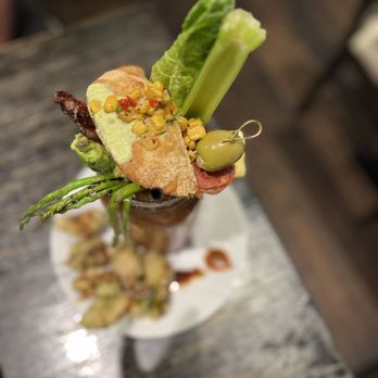 Prime Farm to Table - Bloody Mary with an empanada on top - New American Near Me - Flower Mound, Texas