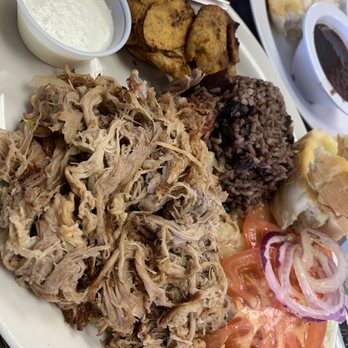 Tropicana Cuban Restaurant - Lechon plate with black beans,black rice side salad and Tostones with mojo to dip is outstanding. Pour the mojo on the pork & WOW ! - Cuban Near Me - Austin, Texas Tropicana Cuban Restaurant - Lechon plate with black beans,black rice side salad and Tostones with mojo to dip is outstanding. Pour the mojo on the pork & WOW ! - Cuban Near Me - Austin, Texas