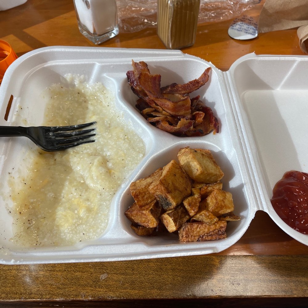 Cheese grits, bacon and home fries. Cheese grits, bacon and home fries.