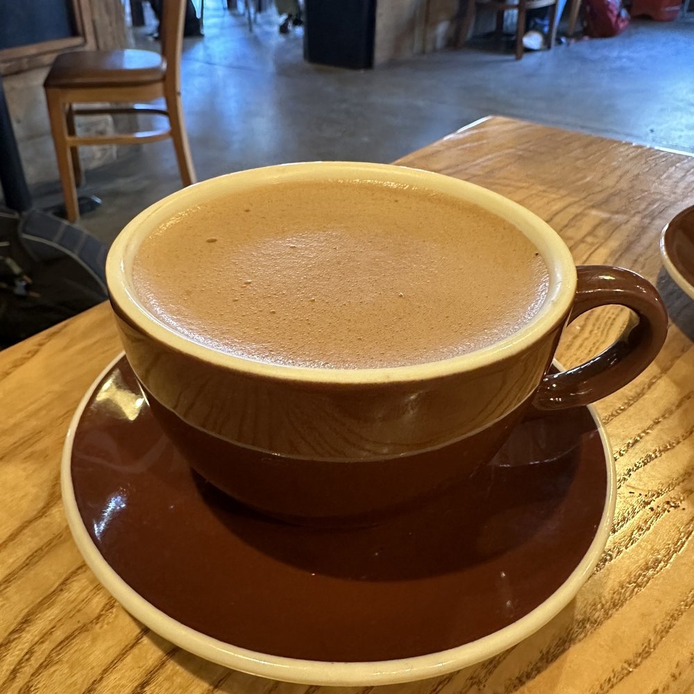 Hot cold brew coffee with oat milk and mocha and toasted marshmallow syrup