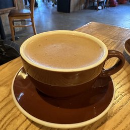Hot cold brew coffee with oat milk and mocha and toasted marshmallow syrup Hot cold brew coffee with oat milk and mocha and toasted marshmallow syrup