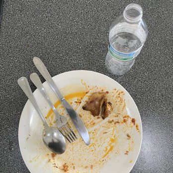 ChefTemii - Jollof rice with peppered goat and plantains....or what's left of it.  AMAZING! - African Near Me - Arlington, Texas