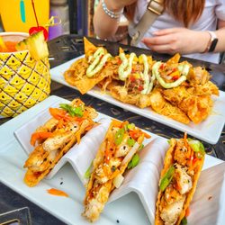 The Tilted Tiki - Asian Chicken Tacos (bottom), Wonton Nachos (top), Hurricane (left)
