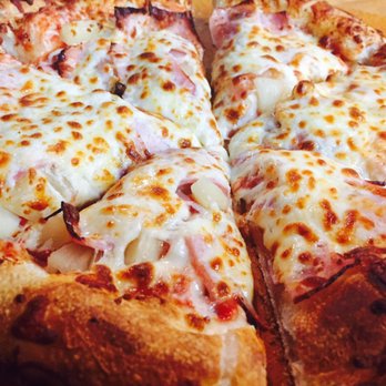 Bill's Pizza - a sliced pizza on a cutting board - Pizza Near Me - Rochdale, Massachusetts Bill's Pizza - a sliced pizza on a cutting board - Pizza Near Me - Rochdale, Massachusetts