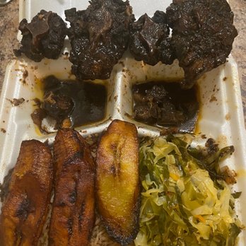Caribbean Grill - The 4 pieces of oxtail I received when I ordered a LARGE oxtail meal for $20.00 - Caribbean Near Me - Montclair, New Jersey