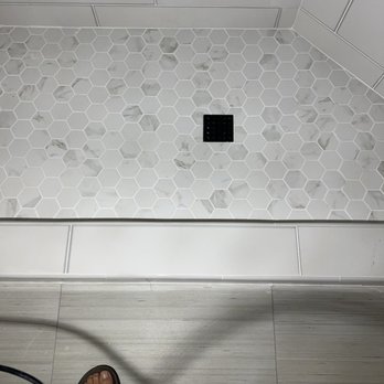 Sterling Tile And Stone - a person standing in a shower - Flooring Near Me Sterling Tile And Stone - a person standing in a shower - Flooring Near Me