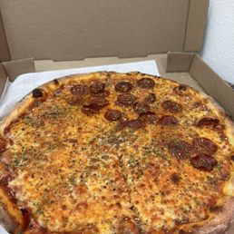 Large pie , half pepperoni , half cheese. I added all the seasonings on top (hence why it's a lot of oregano , I love it lol )