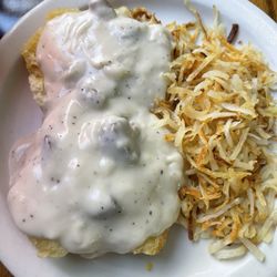 Biscuits and sausage gravy with hash browns
