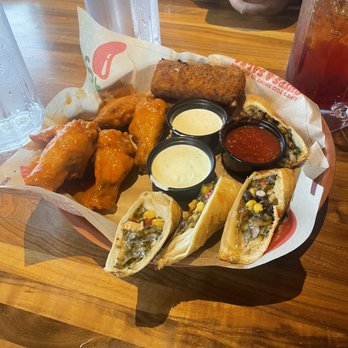 Chili's - Triple Dipper with Fried Mozzarella, Buffalo Wings and Southwestern Eggrolls - American Near Me - Westbury, New York Chili's - Triple Dipper with Fried Mozzarella, Buffalo Wings and Southwestern Eggrolls - American Near Me - Westbury, New York