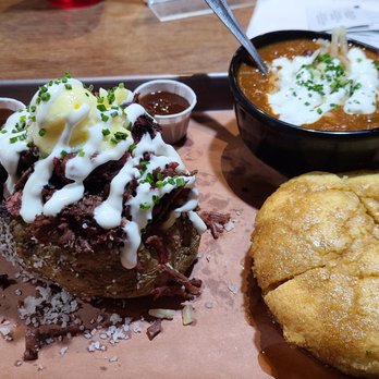 317 BBQ - Baked Potato smothered in pulled pork with all the toppings. Cornbread and Chili was my sides. - Barbeque Near Me - Indianapolis, Indiana