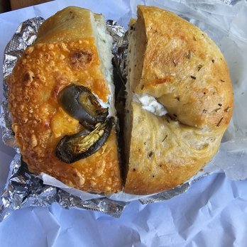 Curley's Bagels - Jalepeno cheddar bagel with scallion smear (left) Rosemary salt bagel with Black truffle smear (right) - Bagels Near Me - Sunnyside, New York Curley's Bagels - Jalepeno cheddar bagel with scallion smear (left) Rosemary salt bagel with Black truffle smear (right) - Bagels Near Me - Sunnyside, New York