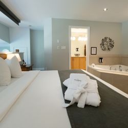 Old House Hotel & Spa - Our loft style Penthouse offers floor to vaulted-ceiling, windows frame picturesque woodland gardens, and a jacuzzi tub on the 2nd floor.