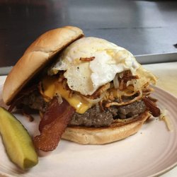 The BurgerBar and grill - The Brunch Burger, tank burger with hash browns, bacon, fried egg, garlic aioli and American cheese on a toastedBurger Bar bun.