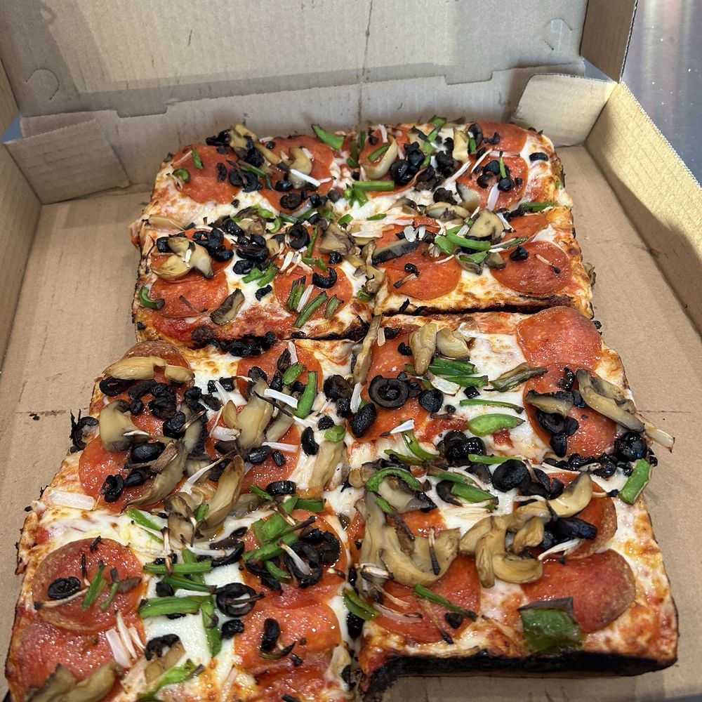 Detroit-style veggie pizza with added pepperoni. Detroit-style veggie pizza with added pepperoni.