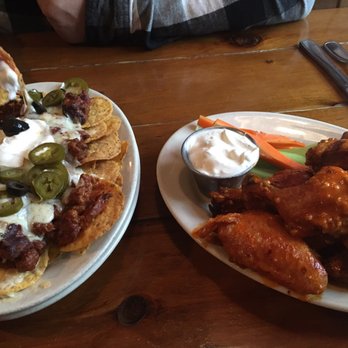Hickory BBQ & Smokehouse - Garlic buffalo wings and Half order of Hickory Nachos - American Near Me - Kingston, New York Hickory BBQ & Smokehouse - Garlic buffalo wings and Half order of Hickory Nachos - American Near Me - Kingston, New York