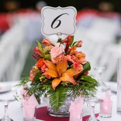Perfect Parties By Mo - Peach to orange centerpiece containing lilies, Alstromeria, Dahlias and carnations.