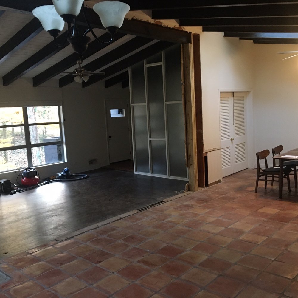 Structural Fix - a dining room with a brick floor - Grout Services Near Me - Douglasville, Georgia