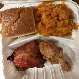 Classic meal with one smothered thigh, pan-fried drumstick, cornbread and yam Classic meal with one smothered thigh, pan-fried drumstick, cornbread and yam