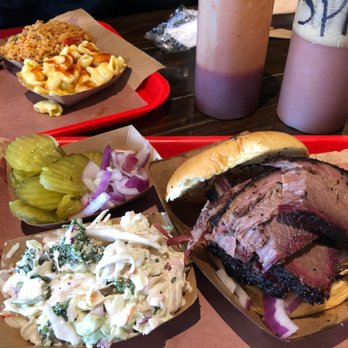 Terry Black's Barbecue - brisket sandwich with a side of coleslaw. pickles are free. mac and cheese side on the background - Barbeque Near Me - Austin, Texas Terry Black's Barbecue - brisket sandwich with a side of coleslaw. pickles are free. mac and cheese side on the background - Barbeque Near Me - Austin, Texas