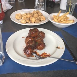 Meatball appetizer with fries and a breaded mushroom appetizer