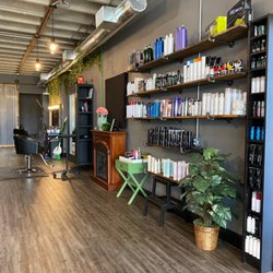 The Lab Hair Studio - Product wall and fireplace