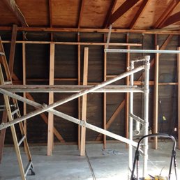 Unfinished Garage, with only three beams going across. Unfinished Garage, with only three beams going across.