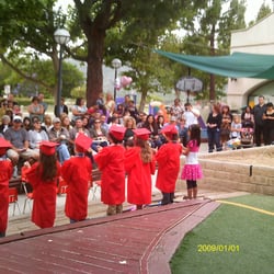 Our student graduates reciting a poem to their families at our culmination ceremony in June.