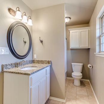 Turner & Son Homes - a bathroom with a toilet and sink - General Contractors Near Me - Oklahoma City, Oklahoma Turner & Son Homes - a bathroom with a toilet and sink - General Contractors Near Me - Oklahoma City, Oklahoma