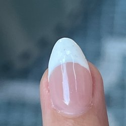Dahlia Nails & Spa - Brown specks in the nail