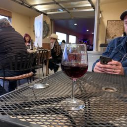Waiting for my delicious pizza and enjoying some great wine while waiting for the rock band to play. Waiting for my delicious pizza and enjoying some great wine while waiting for the rock band to play.