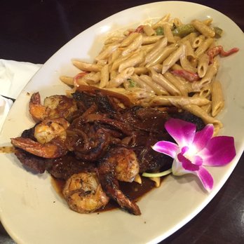 Footprints Cafe - Steak and shrimp with rasta pasta. Steak was overcooked - not good. - Caribbean Near Me - Brooklyn, New York