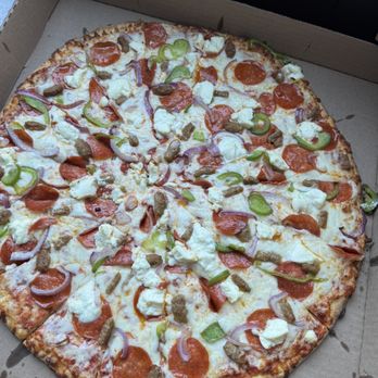 Giovanni's Trattoria - Pizza called the works pepperoni, green bell peppers, red onion, Italian sausage and ricotta cheese - Pizza Near Me - San Diego, California