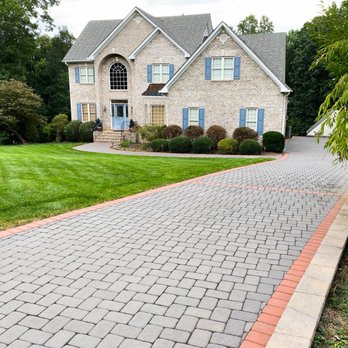 Willow Landscaping - a brick driveway in front of a house - Irrigation Near Me Willow Landscaping - a brick driveway in front of a house - Irrigation Near Me