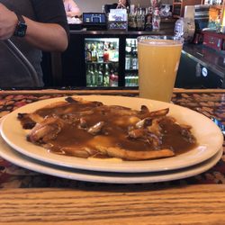 The Spanked Puppy - The poutine tasted better than it looked. The fries were crispy, the cheese melted, and the gravy copious.