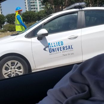 Allied Universal - The security guard had just got back in his car from talking to the tree trimmers in the background. No mask, gloves, no social distancing - Security Services Near Me - Santa Ana, California Allied Universal - The security guard had just got back in his car from talking to the tree trimmers in the background. No mask, gloves, no social distancing - Security Services Near Me - Santa Ana, California