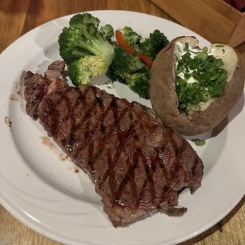 The Mogul Restaurant - New York Steak, baked potato with chives and sour cream and steam veges - Steakhouses Near Me - Mammoth Lakes, California The Mogul Restaurant - New York Steak, baked potato with chives and sour cream and steam veges - Steakhouses Near Me - Mammoth Lakes, California