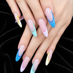 Pure Nails Spa - Colorful tips, glossy finish, and the perfect shape A fun little set to brighten your day and turn heads everywhere.