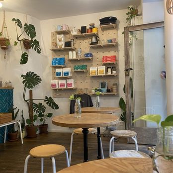 Yellow Tucan - Seating area and merch wall - Cafes Near Me - Paris, 75 Yellow Tucan - Seating area and merch wall - Cafes Near Me - Paris, 75