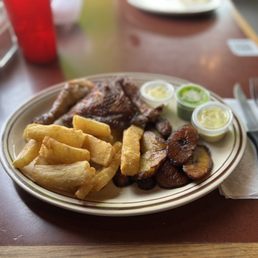 Quarter Dark Rotisserie with yuca and Platanos Maduros