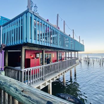Harbour Master Suites - view of the balcony of the restaurant next door.. - Hotels Near Me - Cedar Key, Florida Harbour Master Suites - view of the balcony of the restaurant next door.. - Hotels Near Me - Cedar Key, Florida