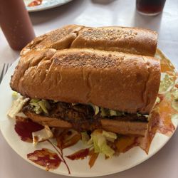 Tacos Cecy - Massive Torta stuffed with Adobada, lettuce, avocados, sour cream, jalapeños - it was 7" x 5"