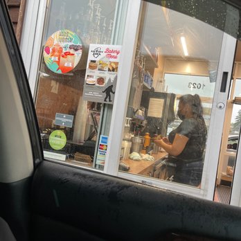 BigFoot Java - a woman in the window of a restaurant - Coffee & Tea Near Me - Seattle, Washington