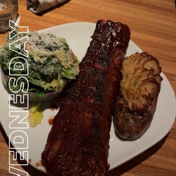 Moxies - Full rack of Ribs with Baked potato and Caesar salad - Cocktail Bars Near Me - Houston, Texas Moxies - Full rack of Ribs with Baked potato and Caesar salad - Cocktail Bars Near Me - Houston, Texas