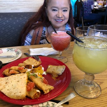 Toro Viejo - a little girl sitting at a table with a plate of food and a drink - Mexican Near Me - Hayden, Idaho Toro Viejo - a little girl sitting at a table with a plate of food and a drink - Mexican Near Me - Hayden, Idaho
